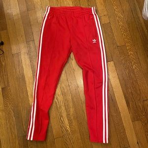 Red adidas track pants